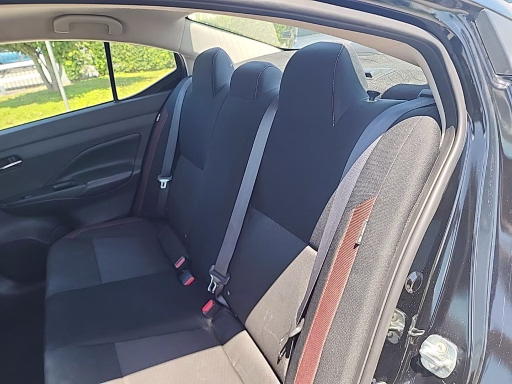 2024 Super Black Nissan Versa 1.6 SR FWD Sedan