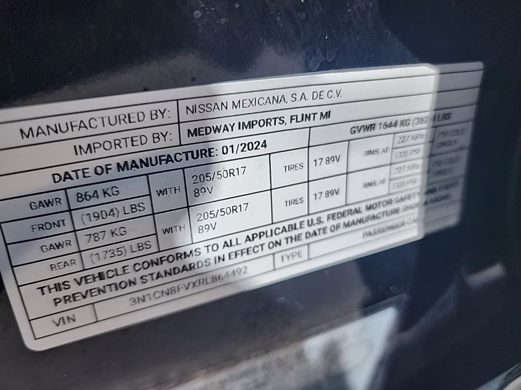 2024 Super Black Nissan Versa 1.6 SR FWD Sedan