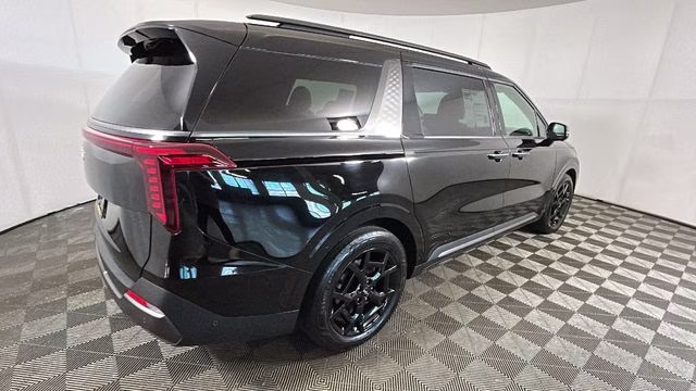 2025 Aurora Black Pearl Kia Carnival SX Prestige FWD Van