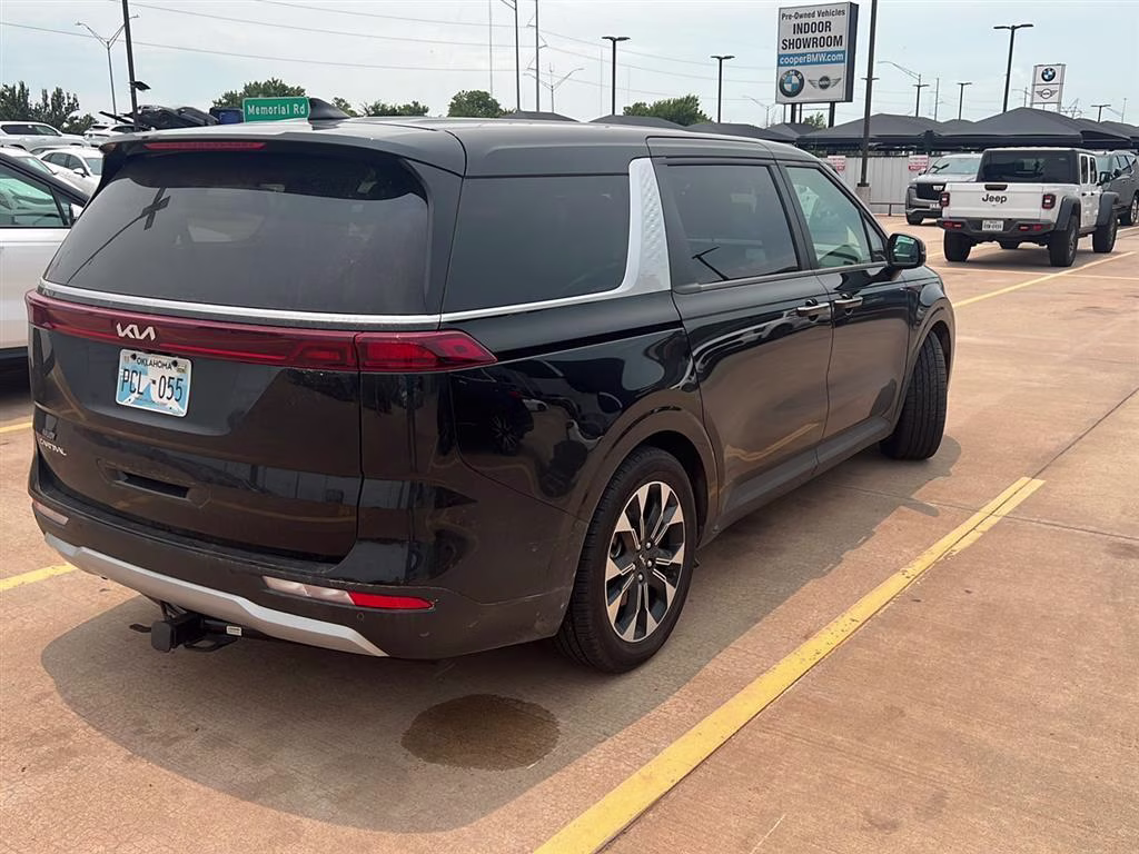 2024 Aurora Black Pearl Kia Carnival EX FWD Van