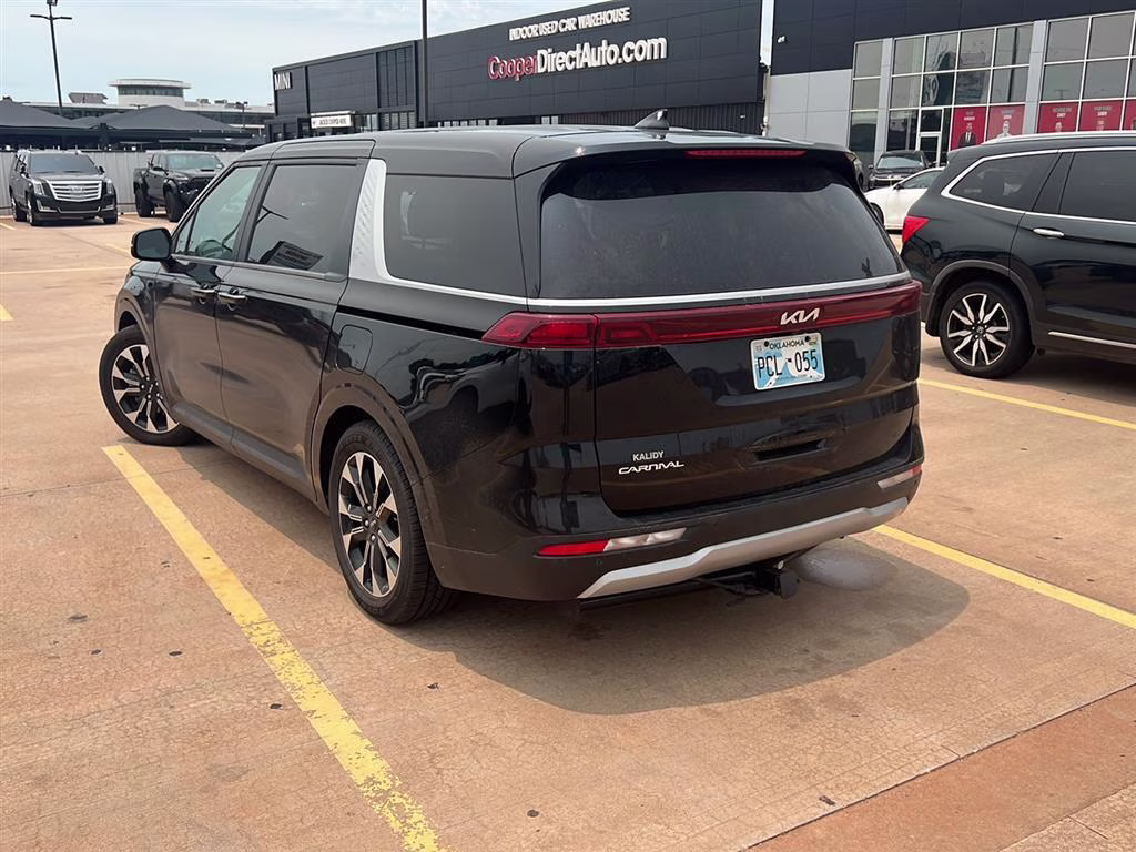 2024 Aurora Black Pearl Kia Carnival EX FWD Van