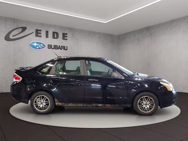 2010 Ebony Ford Focus SE FWD Sedan