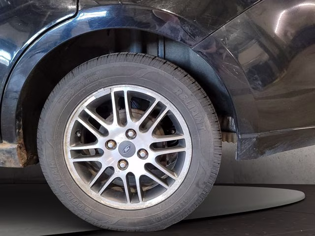 2010 Ebony Ford Focus SE FWD Sedan