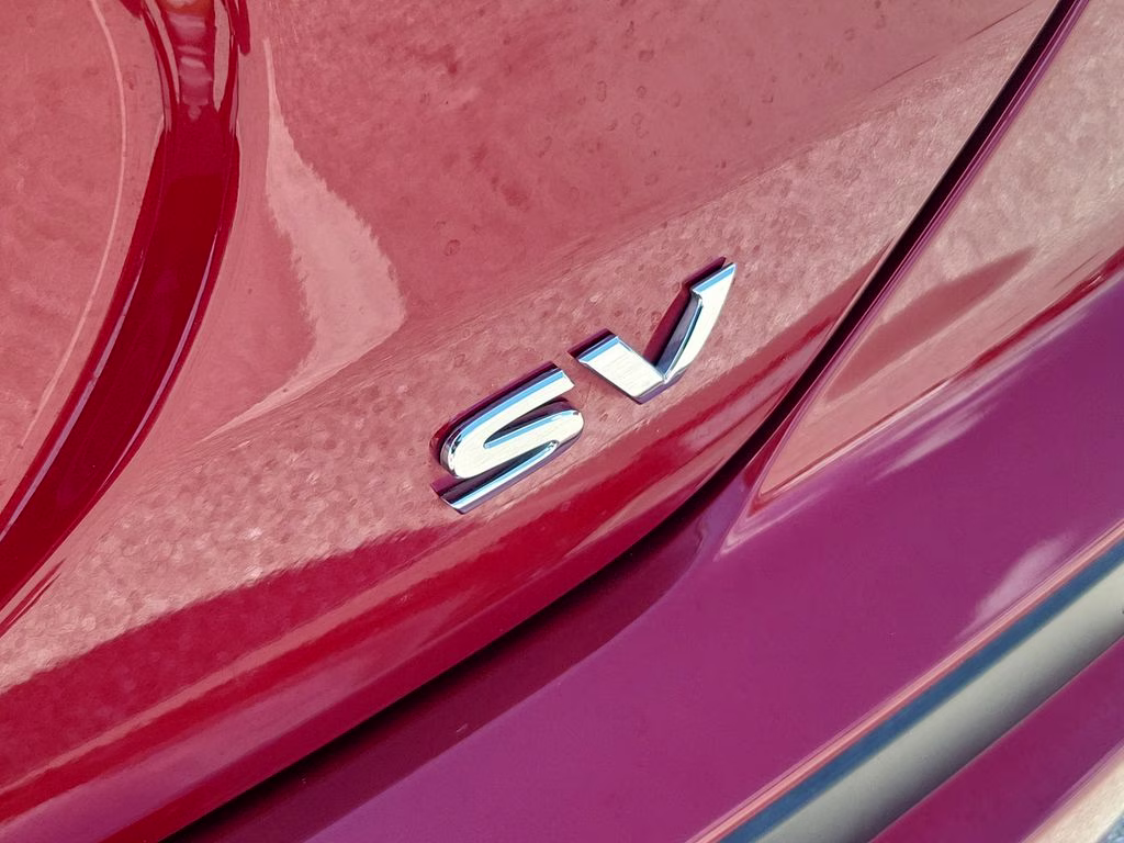 2023 Scarlet Ember Tintcoat/Super Black Nissan Kicks SV FWD SUV