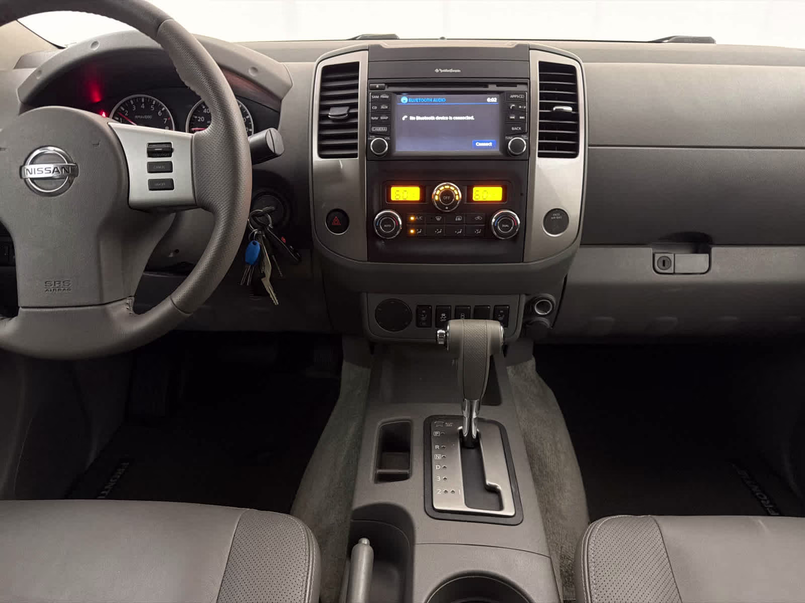 2015 Glacier White Nissan Frontier SL RWD Truck