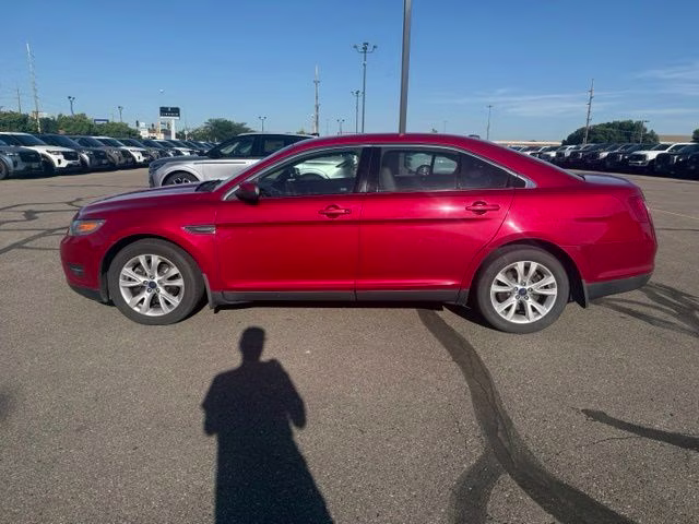 2010 Red Ford Taurus SEL FWD Sedan