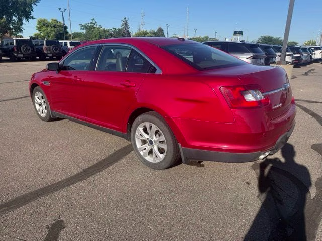 2010 Red Ford Taurus SEL FWD Sedan
