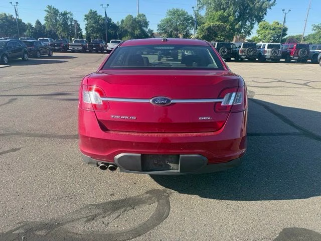 2010 Red Ford Taurus SEL FWD Sedan