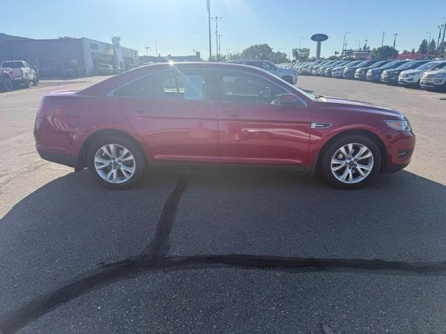 2010 Red Ford Taurus SEL FWD Sedan