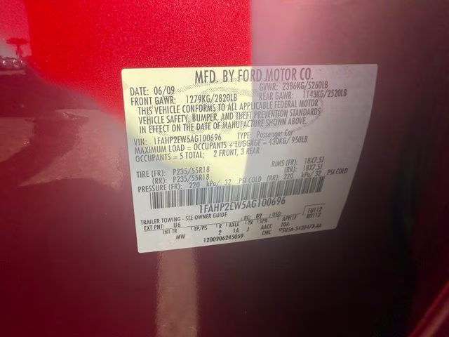 2010 Red Ford Taurus SEL FWD Sedan