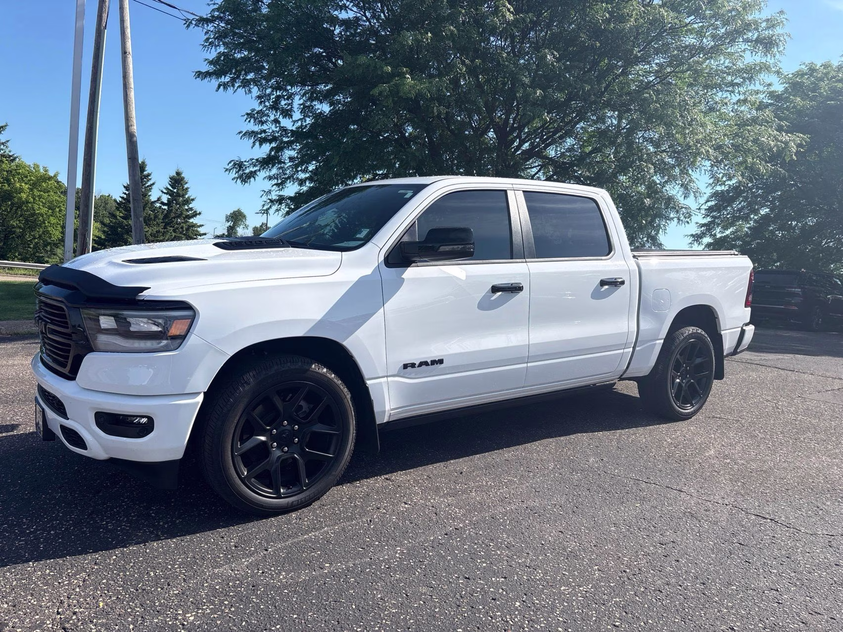 2023 Bright White Clearcoat Ram 1500 Laramie 4X4 Truck