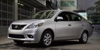 2014 Magnetic Gray Metallic Nissan Versa 1.6 SV FWD Sedan